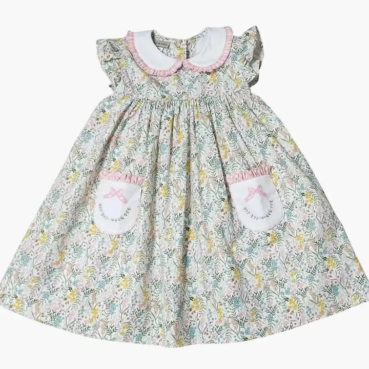 Floral dress with embroidered details on a white background