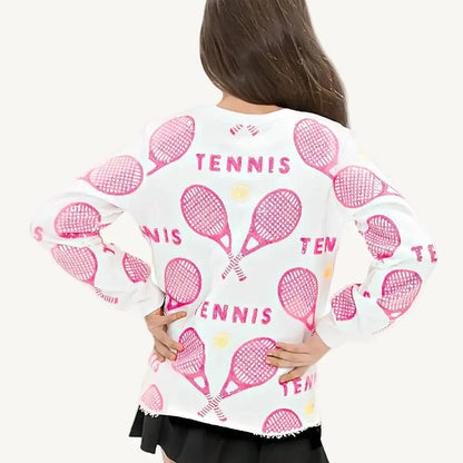 A pink sequin sweatshirt with tennis rackets and balls and a white background.