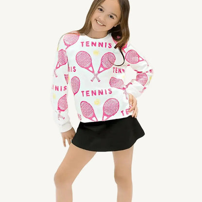 A pink sequin sweatshirt with tennis rackets and balls and a white background.